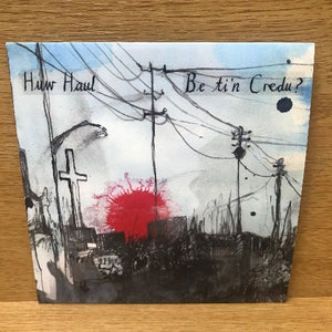 A music CD cover featuring a stylized graphic with a red splash, power lines, and a cross, against a dark background with text that includes the artist name 'Huw Huw' and the title 'Be ti'n credu?'.