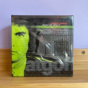 A CD case with a green and black design, featuring text and a profile picture of a person, indicating it is a release by Geraint Jarman.