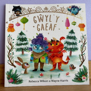 A book cover featuring illustrations of fantasy creatures, with a title 'Gwyl y Gaeaf' written in a decorative font.