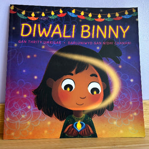 Book titled 'Diwali Binny' with a colorful cover featuring a child holding a Diwali lamp.
