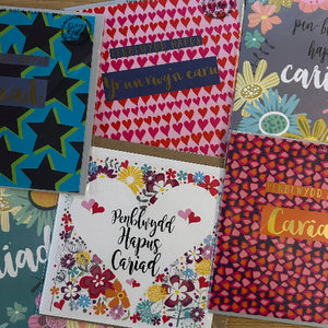 Collection of greeting cards with various designs and text