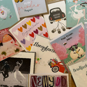 Collection of greeting cards with various designs and text.
