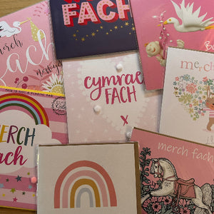 Collection of colorful greeting cards with various designs and text.