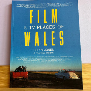 Book titled 'Film & TV Places of Wales' with a scenic cover featuring two cars.