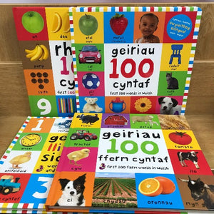 A colorful board book with Welsh text, featuring photographs of objects, fruits, animals, and vehicles.