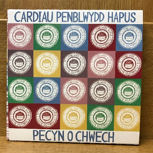 A pack of six Welsh language birthday cards with colorful geometric patterns and text 'CARDIAU PENBLWYDD HAPUS PECYN O CHWECH'.
