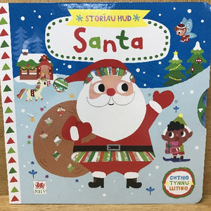 A colorful book cover featuring Santa Claus with a sparkly foil cover wheel, surrounded by Christmas-themed illustrations, with the text 'Santa' at the top and 'Story' in the background.
