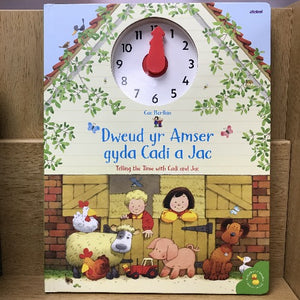 A children's bilingual book cover featuring illustrations of farm animals, children, and a clock with hands, titled 'Dweud yr Amser gyda Cadi a Jac'.