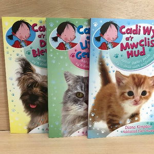 Three children's book covers featuring 'Cadi Wyn' series with illustrations of a girl and various animals including a dog, cat, and kitten.
