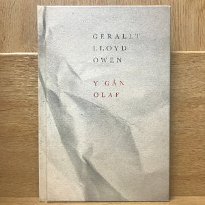 A book cover featuring the title 'Y Gãn Olaf' with the author's name 'GERALLT LLOYD OWEN' across the top. The cover has a grey and white tone with minimal decorative elements.