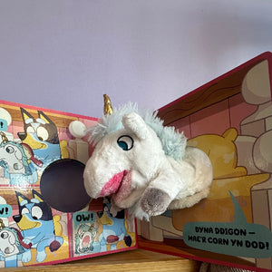Plush toy with cartoon characters on a colorful background