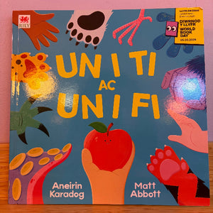 Children's book cover with colorful illustrations and text on a pink background