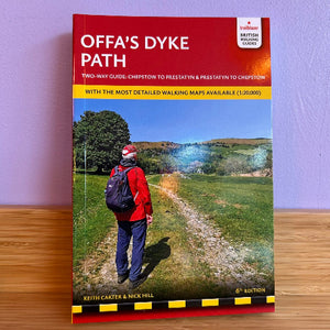 Book cover of 'Offa's Dyke Path' with a person walking on a path in a scenic landscape.