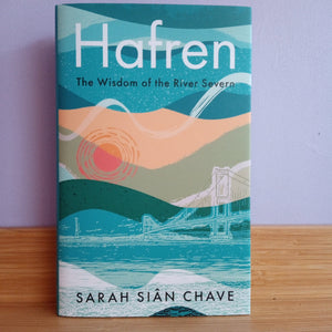 Book cover of 'Hafren: The Wisdom of the River Severn' by Sarah Siân Chave on a wooden surface with a purple background.