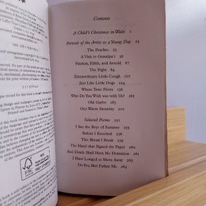 Table of contents page of a book with a wooden surface and white background