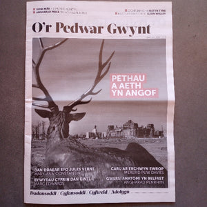 Newspaper with a deer silhouette and text on a gray background