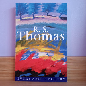Book cover of 'Everyman's Poetry' by R. S. Thomas with colorful abstract design on a wooden surface.