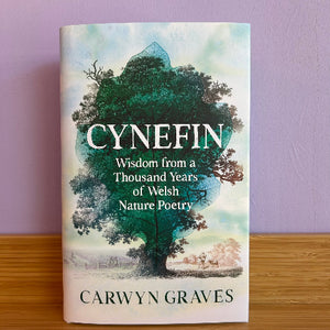 Book cover of 'Cynefin: Wisdom from a Thousand Years of Welsh Nature Poetry' by Carwyn Graves with a tree illustration on a purple background.
