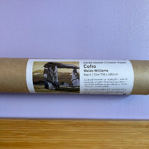 Roll of paper with a label featuring an image of a stone structure on a purple background