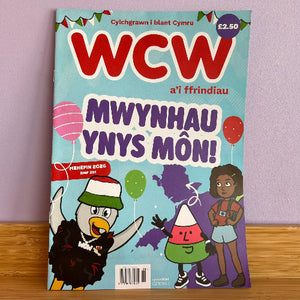 Magazine cover with cartoon characters and colorful text on a light blue background