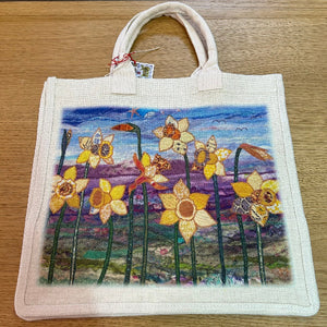 Tote bag with a floral design on a wooden surface