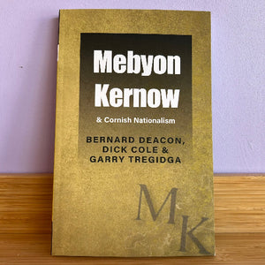 Book titled 'Mebyon Kernow & Cornish Nationalism' by Bernard Deacon, Dick Cole, and Garry Tregidga on a wooden surface with a purple wall background.