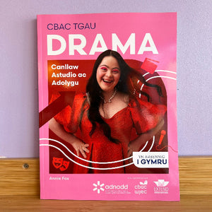 GCSE Daram study guide in Welsh with a woman in a red dress on a pink background