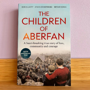 The Children of Aberfan hardcover book. The cover features a pale blue upper section with large red and orange title text, and a sepia-toned historical crowd scene on the lower half.