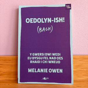 Purple book cover with white text on a pink background