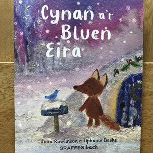 Book cover with a fox and bird in a snowy scene, titled 'Cynan a'r Bluen Eira'.
