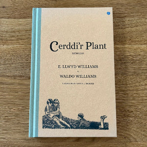Book titled 'Cerddi'r Plant' by E. Llwyd Williams and Waldo Williams on a wooden surface