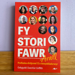 Book titled 'FY STORI FAWR Arall' with circular portraits on a red background