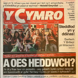 Newspaper cover with a group of people and text in Welsh
