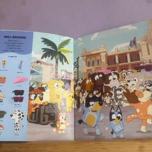 Open book showing animated characters in a city street scene with palm trees and buildings.