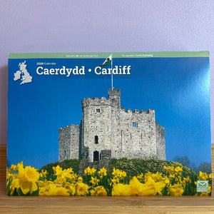Calendar cover featuring a castle and yellow flowers with 'Caerdydd Cardiff' text.