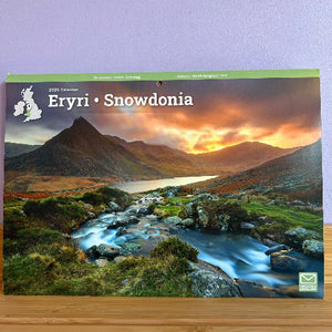 Calendar cover featuring a scenic view of mountains and a lake with 'Eryri Snowdonia' text.