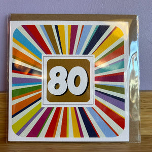 Colorful birthday card with number 80 on a striped background