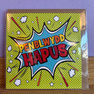 Greeting card with colorful text 'PENBLWYDD HAPUS' on a polka dot background