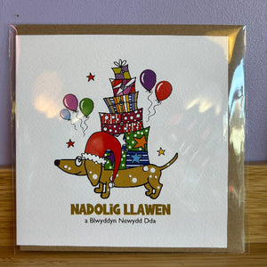 Greeting card with a dog, presents, and balloons on a white background