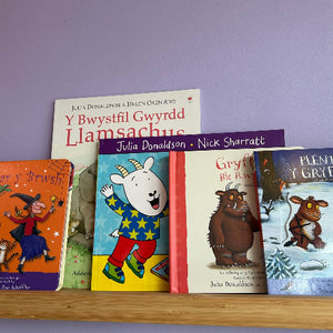 Collection of children's books on a shelf