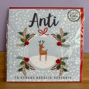 Card with a reindeer design and text on a light blue background