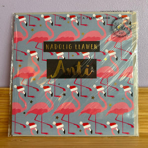 card with pink flamingo design and text on a gray background
