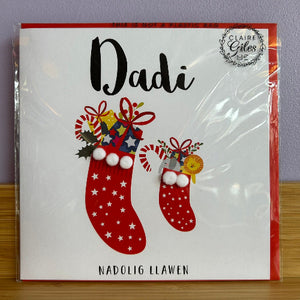 Card with red stockings and 'Dadi' text