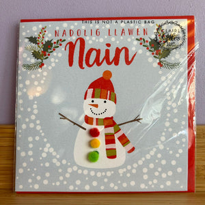 Packaging with a snowman design and text on a light blue background