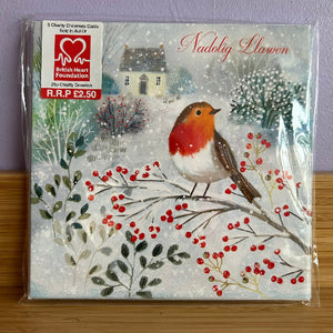 Packaged Christmas card with a robin and berries on a snowy background, featuring the British Heart Foundation logo.