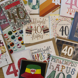 Collection of 40th birthday cards with various designs and text.