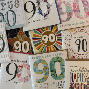 Collection of 90th birthday cards with various designs and colors.
