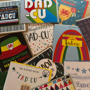 Collection of colorful greeting cards with various designs and text.