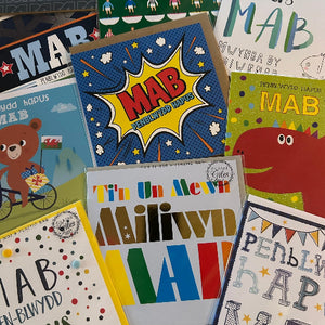 Collection of colorful cards with various designs and text.