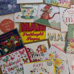 Collection of colorful greeting cards with various designs and text.